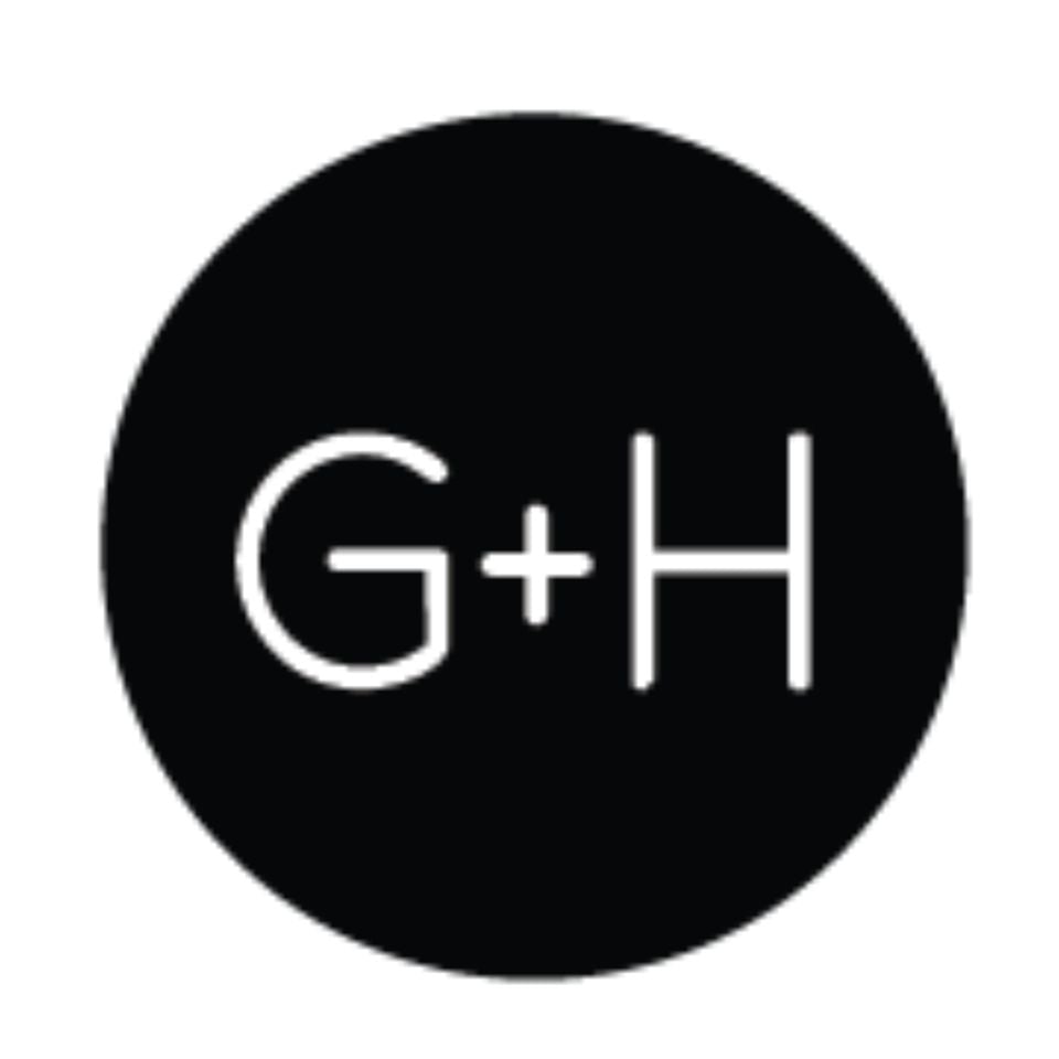 The letters G + H in black