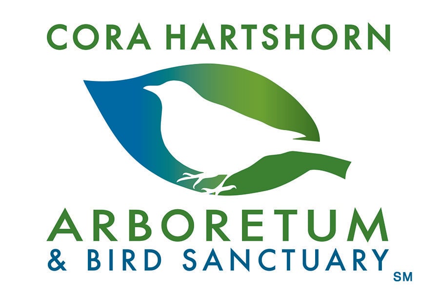 Cora Hartshorn Arboretum & Bird Sanctuary; graphic of a blue/green leaf with a cutout outline of a bird