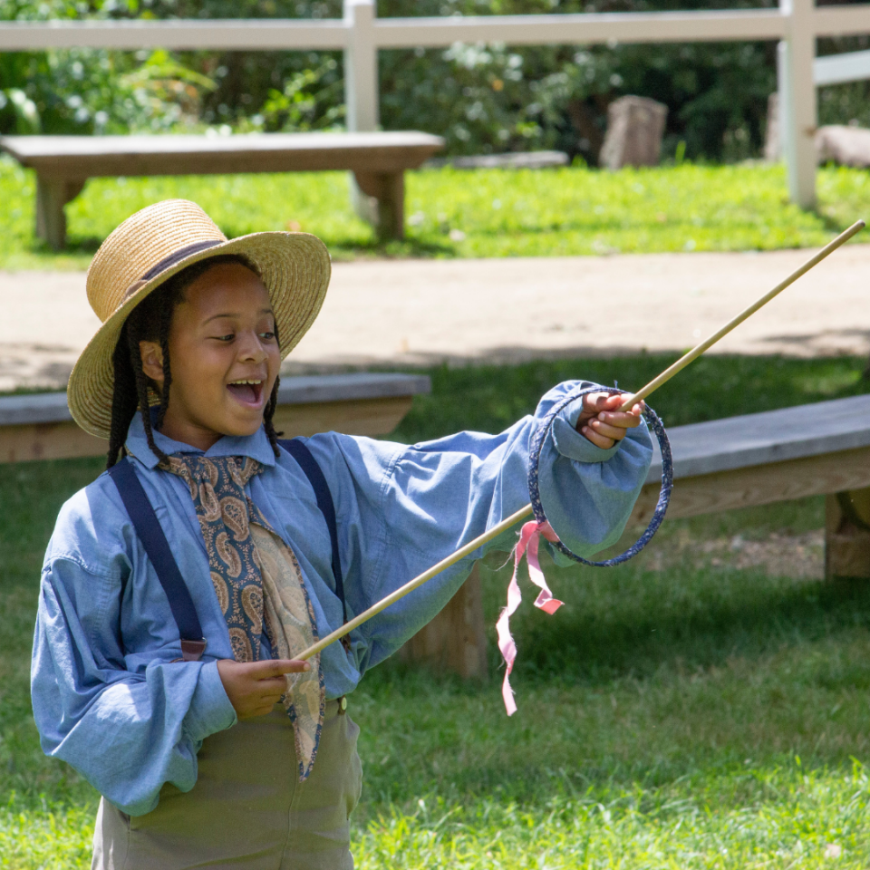 Child having fun at Old Sturbridge Village Discovery Days