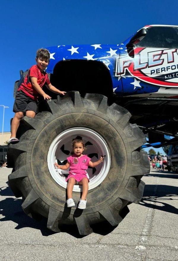 Kids sitting on monster truck