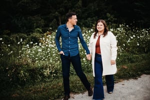 Couple holding hands walking in a nature preserve