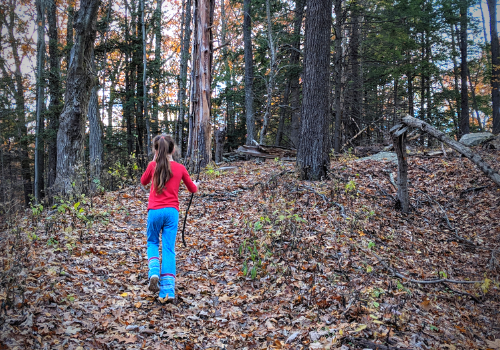 girl hiking in woods