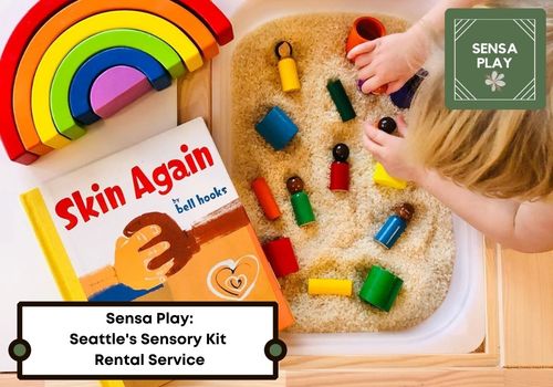 Child playing in a rainbow themed sensory bin