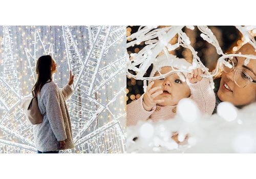 girl and baby looking a christmas lights