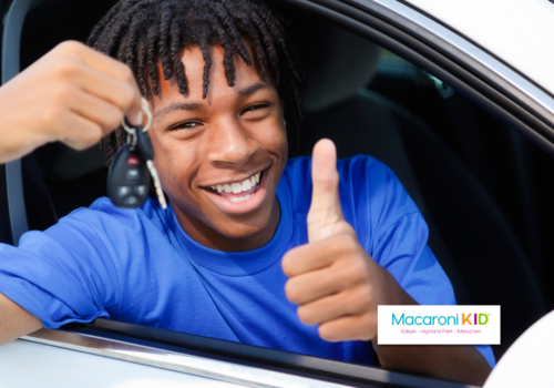 Teen giving thumbs up outside of car window