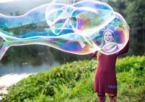 woman making giant bubbles