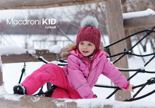 Girl playing in playground in winter