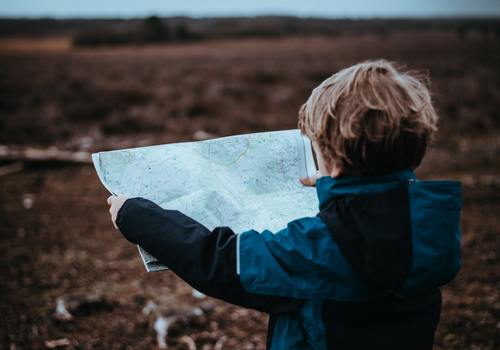 Young Boy looking at map