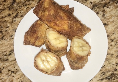Egg roll filled with banana, hazelnut spread, and peanut butter