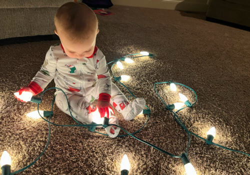 Baby looking at holiday lights