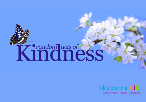 Random acts of kindness text with a butterfly and a branch with white flowers on a blue background