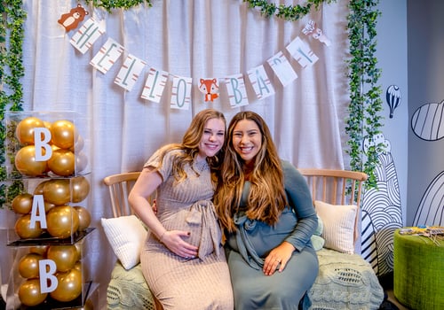 moms-to-be in photo area at Douglas County Libraries Baby Shower