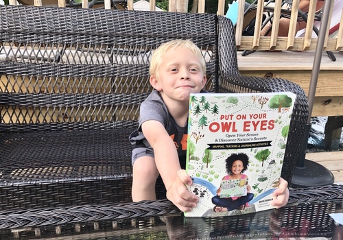 boy with Put on Your Owl Eyes Storey Publishing Flying Deer Nature Center