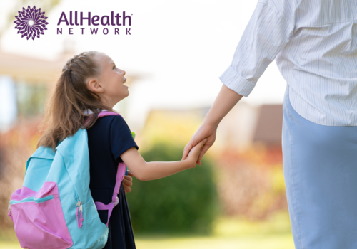 child walking with and talking to parent after school