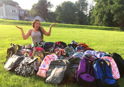 pile of donated backpacks