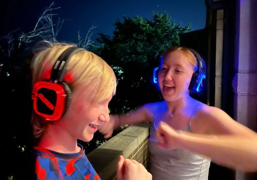 Kids with headphones dancing
