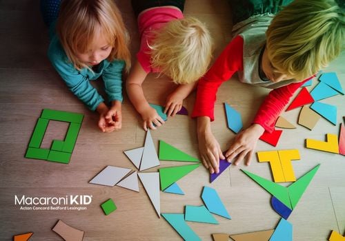 Kids playing with shape pieces