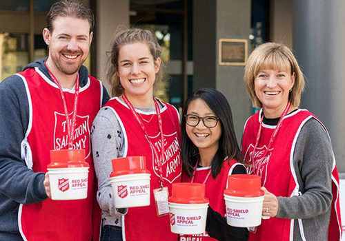 salvation army volunteers smiling in group photo