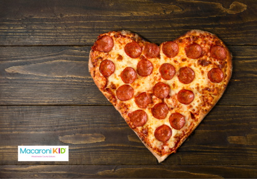 Picture of a heart shaped pizza with pepperoni