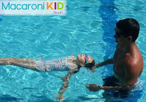 Young girl taking swimming lessons