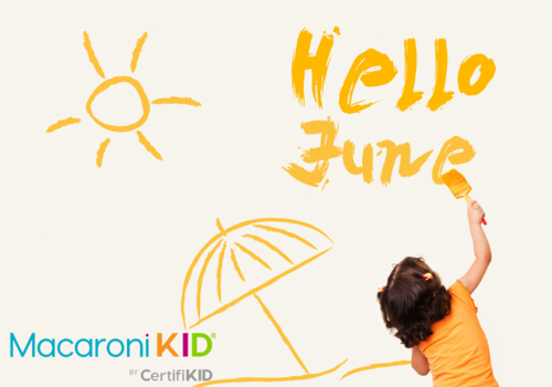 Hello June, little girl writing hello June with hand drawn image of sun and umbrella too.