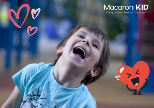 Boy Laughing with Valentine hearts