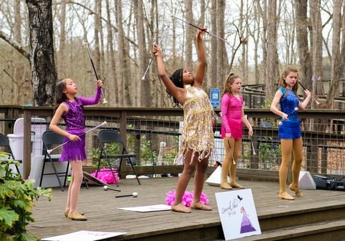 photo of young females performing with patons