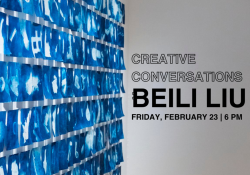 a wall of blue art showcased to promote the creative conversations event