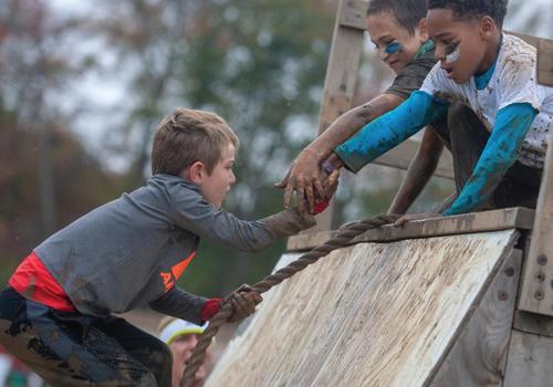 Tough Mudder Kids participating in obstacle course
