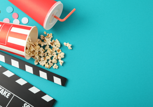 Flat Lay. Drink, Bucket with Popcorn, Clapperboard and Confetti