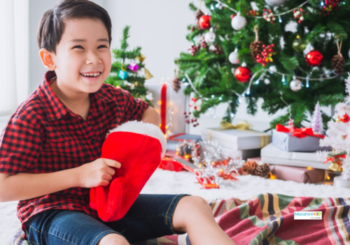 kid opening Christmas stocking