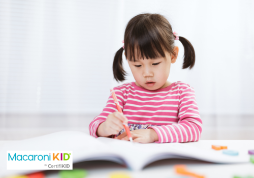 toddler girl practice writing letters for homeschooling