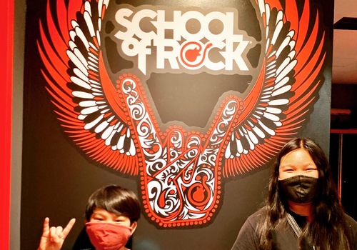 school of rock santa ana kids in front of sign