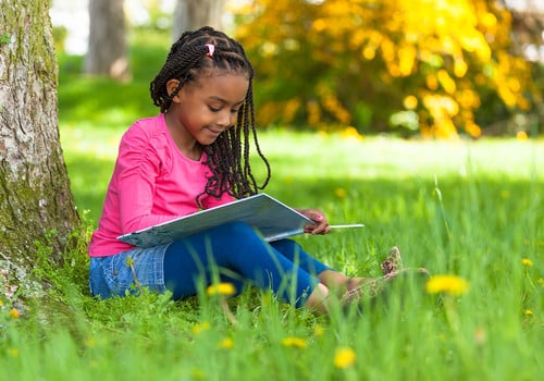 Girl reading outside