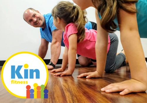 Trainer and kids in fitness studio