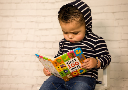 little boy readinghttps://pixabay.com/en/toddler-reading-kids-fashion-3995508/