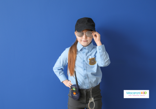 young girl dresses as police officer