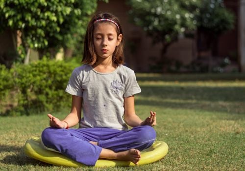 Girl in meditation pose