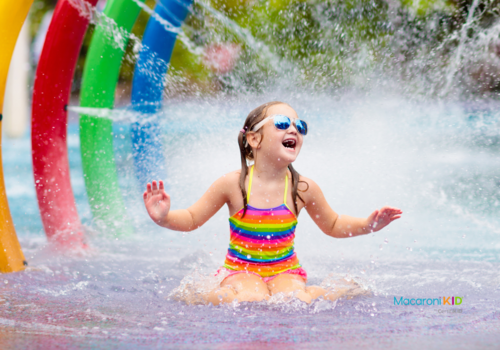 Kids at aqua park. Child in splash pad