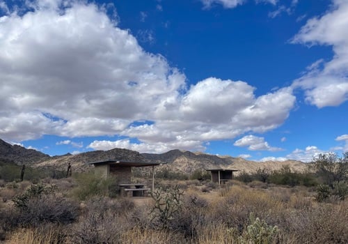 Outdoor picnic tables with White Tank Mountains in the background