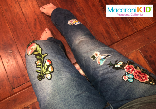 jeans covered in embroidered patches