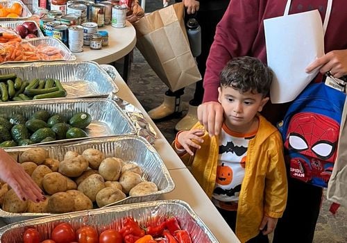 Boy at a produce market