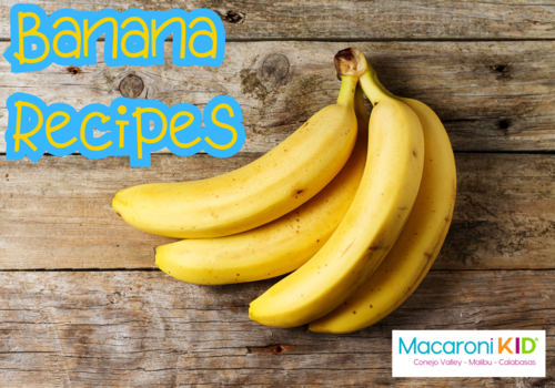 Banana Recipes, a bunch of ripe yellow bananas on a worn wood unfinished table