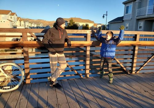 sparks marina bridge on path author's boyfriend and son happy having funthings to do outdoors in sparks reno area kids family ideas outside