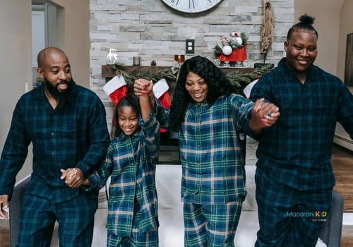 Happy black family having Christmas celebration together