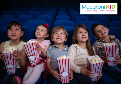 Group of Kids holding popcorn at the movies