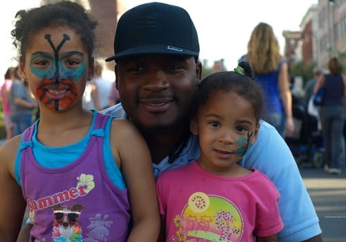 father; daughters; painted face; fair; festival