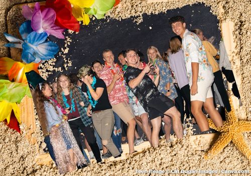 Teens having fun dancing at luau