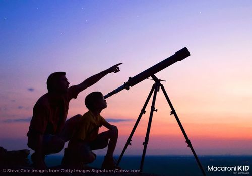 father and son Star Gazing with telescope