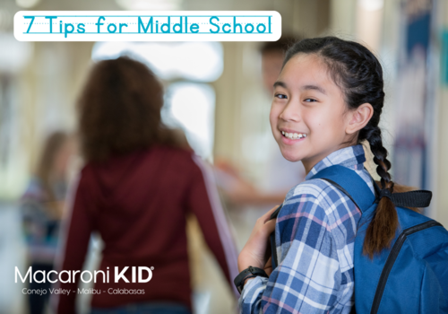 pre-teen girl at school with a backpack on looking back and smiling - 7 Tips for Middle School by Courtney Hale from Getty Images Signature via Canva